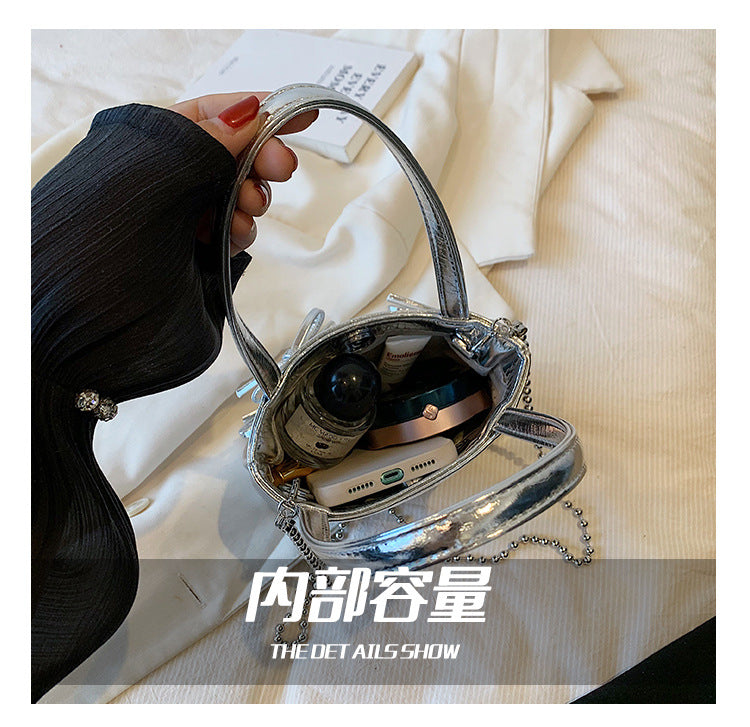 【BSDDD9012】實拍甜美酷辣銀色蝴蝶結鏈條單肩水桶包240601
