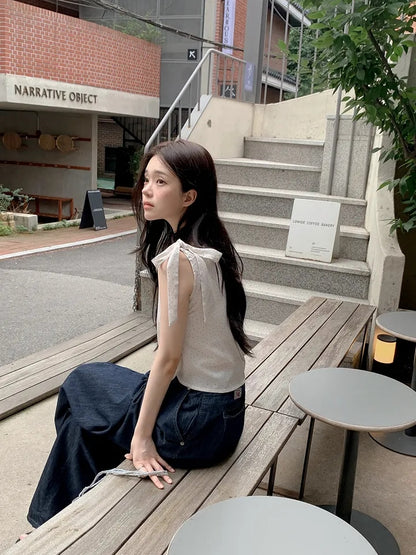 【F60527】韓系甜美純慾風🤍不規則斜肩綁帶點點抓皺無袖上衣260316